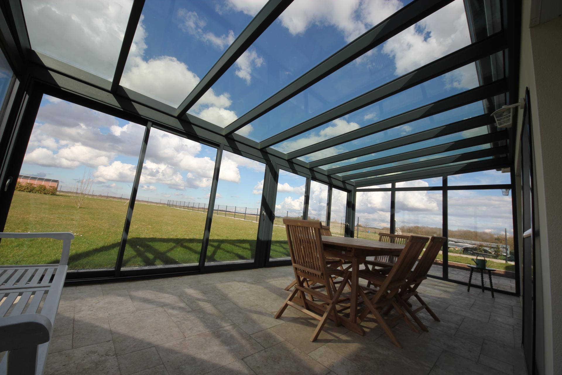 Véranda toiture triple vitrage